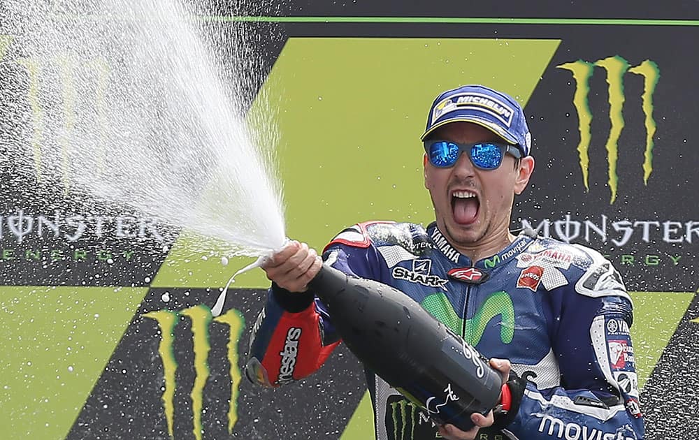 Yamahas MotoGP rider Jorge Lorenzo of Spain celebrates on the podium of the French Grand Prixs race, in Le Mans, western France.