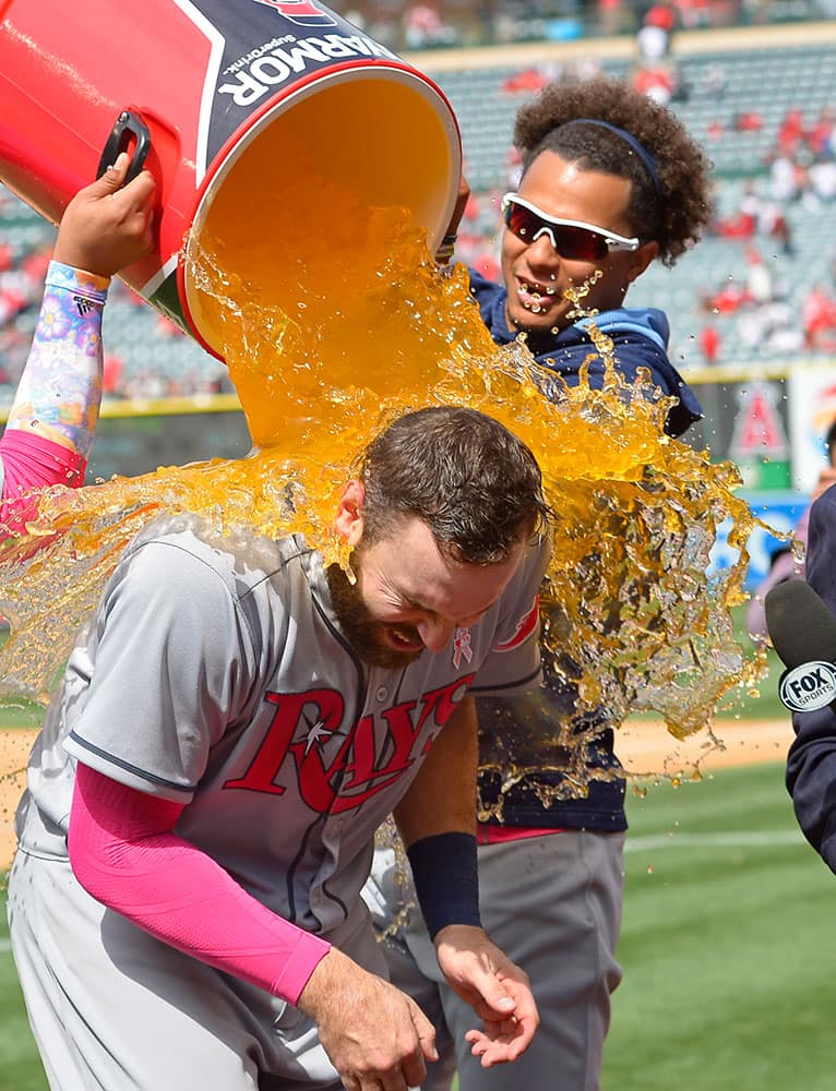 Tampa Bay Rays' Chris Archer, top, douses Curt Casali after they defeated the Los Angeles Angels in a baseball game in Anaheim, Calif. 