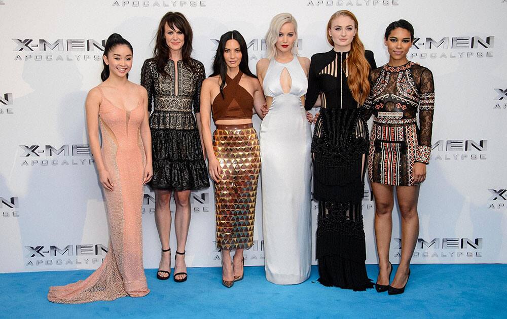 From left, Lana Condor, Carolina Bartczak, Olivia Munn, Jennifer Lawrence, Sophie Turner and Alexandra Shipp pose for photographers upon arrival at the screening of the film X-Men: Apocalypse at a central London .