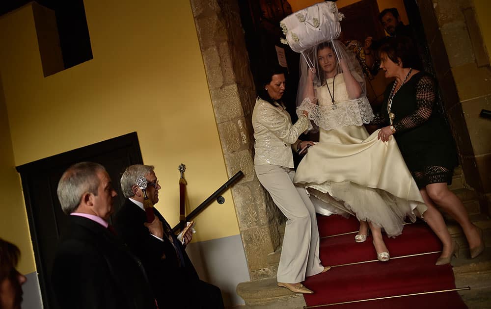 A participant in the ''Bread Procession of the Saint'' walks down the stairs before taking part in a ceremony in honor of Domingo de La Calzada Saint (1019-1109), in Santo Domingo de La Calzada, northern Spain.