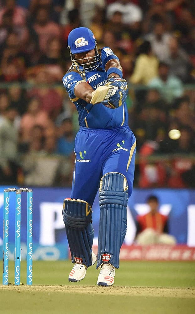 Mumbai Indians batsman Kieron Pollard plays a shot during IPL 2016 match against Royal Challengers Bangalore at Chinnaswamy stadium in Bengaluru.