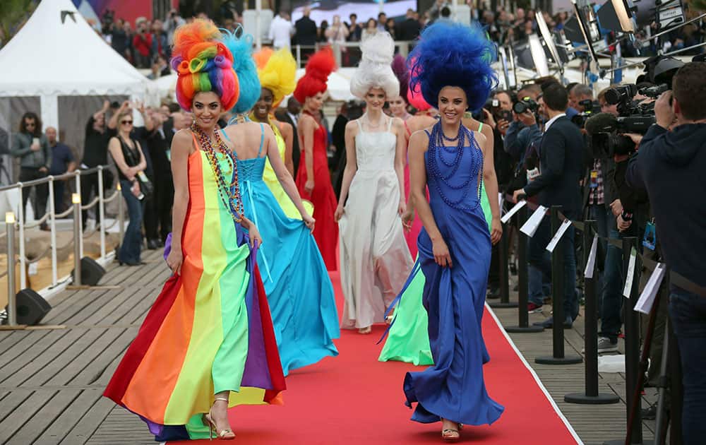 Models walk on the red carpet, during a photo call for the film Trolls at the 69th international film festival, Cannes, southern France.