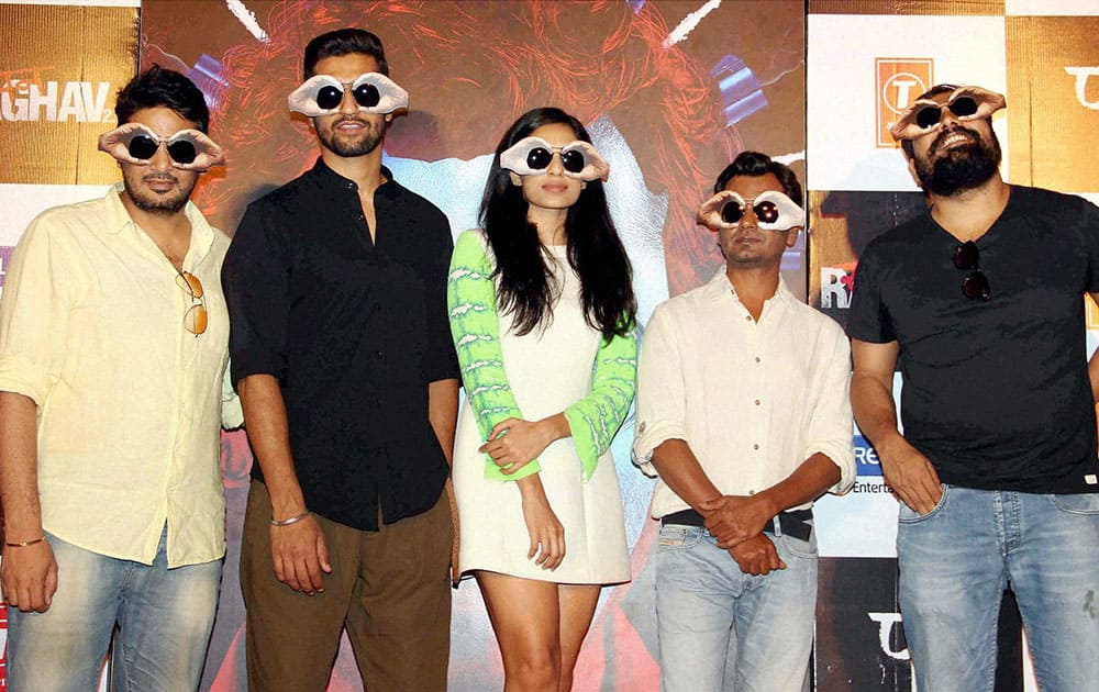 Actors Nawazuddin Siddiqui (2nd R), Vicky Kaushal (2nd L), Sobhita Dhuliwala (C) and filmmaker Anurag Kashyap (R) at the trailer launch of their upcoming film Raman Raghav 2.0, in Mumbai.
