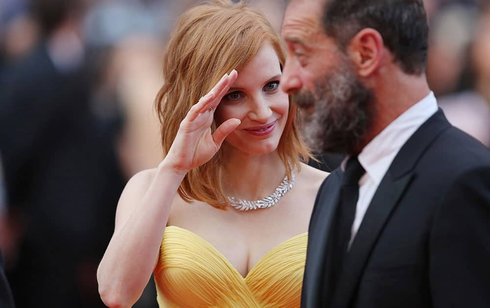 Actors Jessica Chastain, left, and Vincent Lindon pose for photographers upon arrival at the screening of the film Cafe Society and the Opening Ceremony at the 69th international film festival.