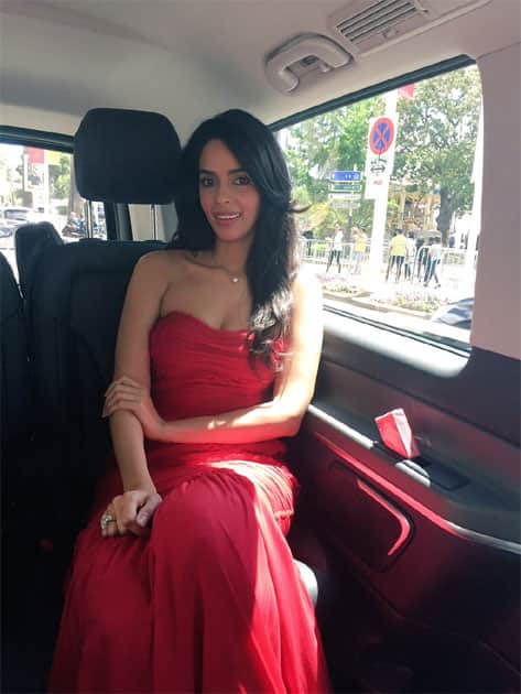 On my way to the press conference for my upcoming international film #timeraiders wearing @dolcegabbana- twitter@mallikasherawat