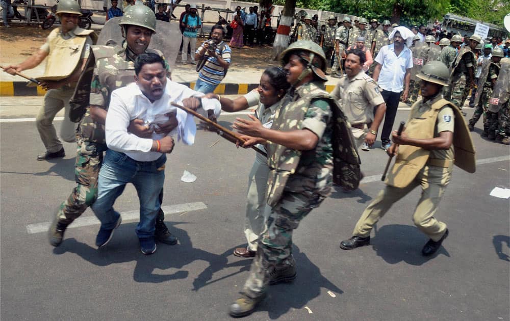 Police in action against BJP Yuva Morcha members during their assembly Gherao protest over unemployment in Bhubaneswar.