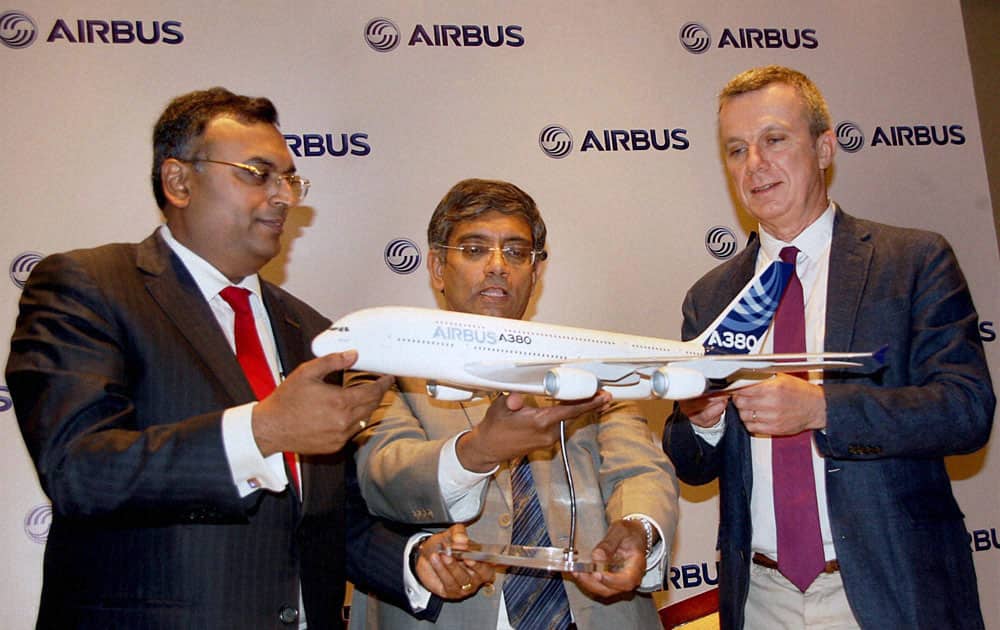 Airbus MD Srinivasan Dwarakanath (C), Chairman and CEO, Aequs, Aravind Melligeri and Olivier Cauquil (R), SVP, Material and Parts Procurement, Airbus at the signing of a contract between Airbus and Aequs in Bengaluru.