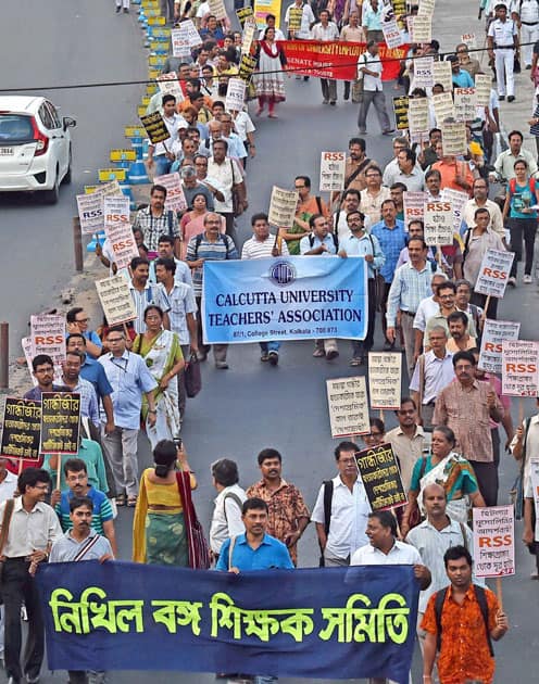 Intellectuals and students under the banner of Joint platform of Movement for Education participate in a rally in Kolkata to protest against alleged attack of ABVP activists on the students of Jadavpur University during screening of film Buddha in a Traffic jam.