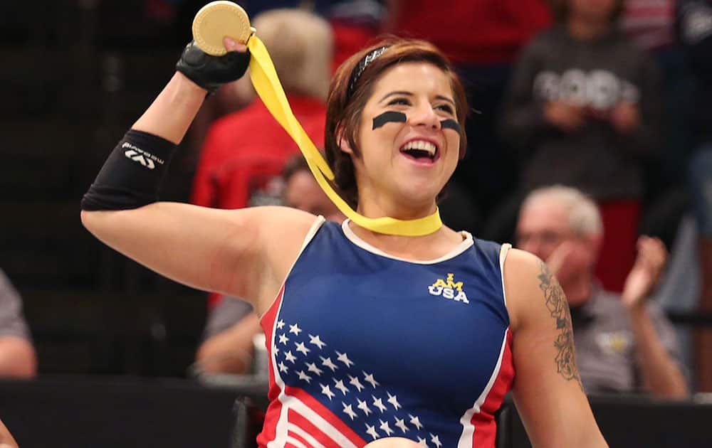 Team USA player Sebastiana Lopez-Arellano celebrates after winning the wheelchair rugby gold medal match against Denmark at the Invictus Games in Orlando, Fla.