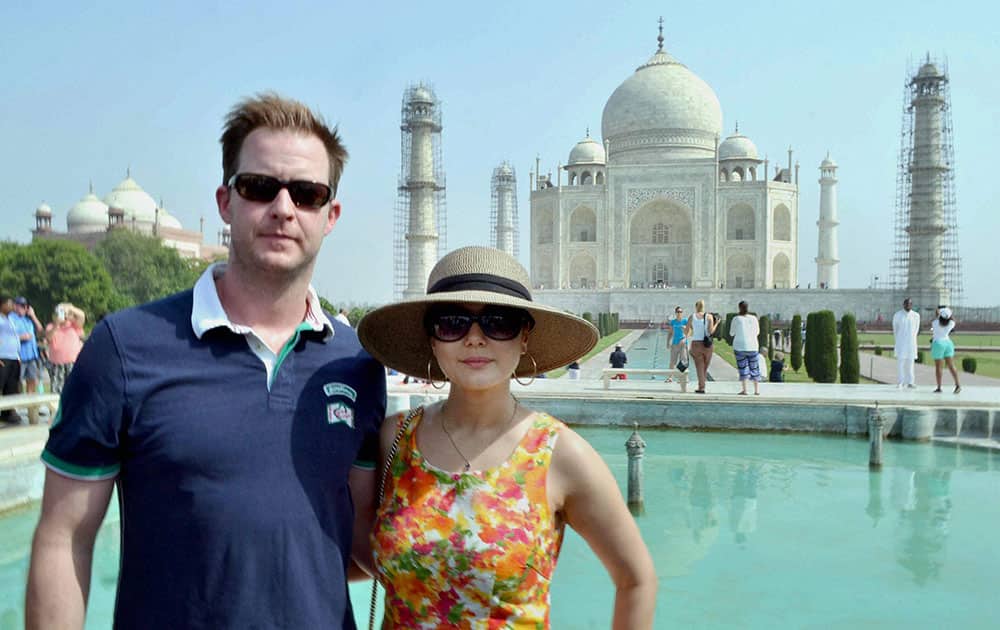 Bollywood actress Preity Zinta with her husband Gene Goodenough pose for a photograph at the Taj Mahal in Agra.