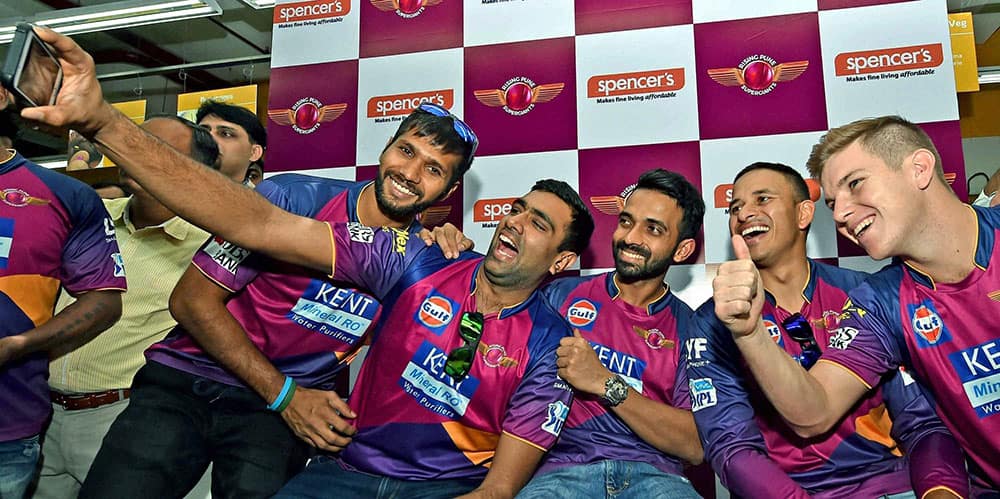 Pune Supergiants players Ashok Dinda, Ravichandran Ashwin, Ajinkya Rahane, Usman Khawaja and Adam Zampa take selfie during a promotional event in Kolkata.