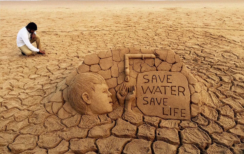 Renowned sand artist Sudarsan Pattnaik creates a sand art on water crisis with message Save Water, Save life at Puri beach of Odisha.