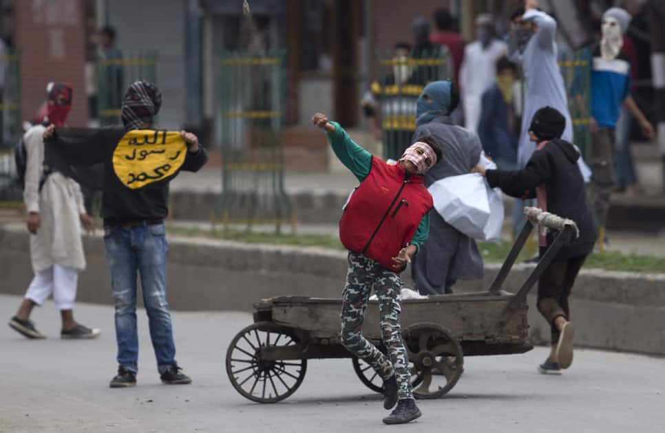 Kashmiri Muslim protesters throw stones at Indian security personnel during a protest in Srinagar,Kashmir.
