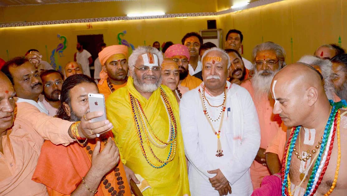 RSS Chief Mohan Rao Bhagwat with sadhus at Karshini Akhada during Simhastha Mahakumbh in Ujjain.
