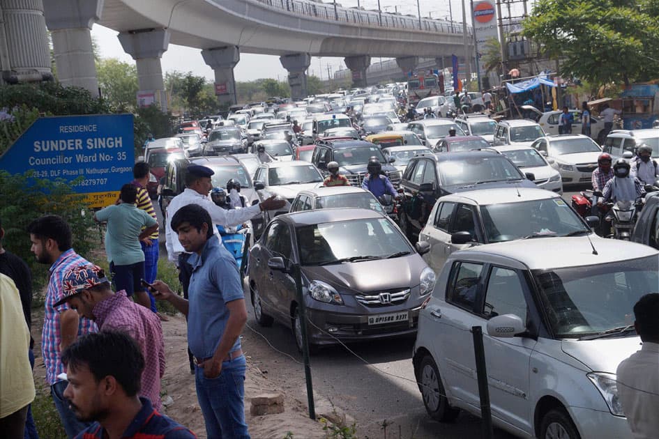 Villagers of Nathupur jam the traffic for water and proper electricity near Guru Dronacharya Metro station in Gurgaon.