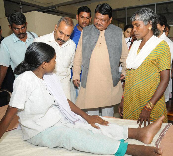 Union Tribal Affairs Minister Jual Oram visits the tribal woman who lost her two children due to malnutrition, at Kozhikode medical college.