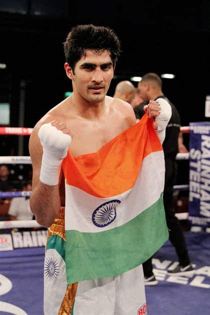 Boxer Vijender Singh celebrates his sixth successive victory in Pro Boxing after a comfortable knockout win over Polands Andrzej Soldra in Bolton.