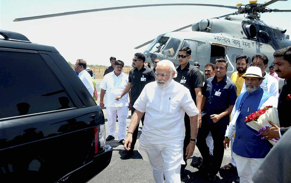 Prime Minister Narendra Modi arrives at the Indore airport on Saturday. The PM was on his way to attend the Simhastha International Vichar Maha Kumbh, an international conference on Living The Right Way, at Ninora village in Ujjain.