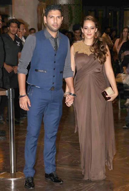 Cricketer Yuvraj Singh with fiance Hazel Keech at the wedding reception of Preity Zinta and Gene Goodenough, in Mumbai.