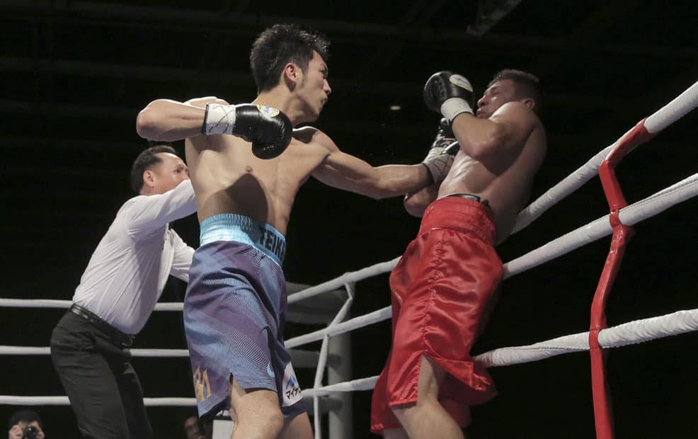 Olympic gold medalist Ryota Murata of Japan, left, fights with Brazils Felipe Santos Pedroso during their middleweight division boxing match of the Clash of the Champions in Hong Kong.