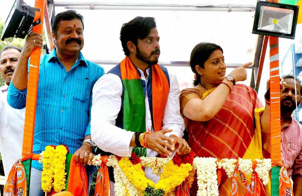 Union HRD Minister Smriti Irani and Rajya Sabha MP Suresh Gopi with former Indian pacer S Sreesanth, the BJP candidate for Thiruvananthapuram during a roadshow in Thiruvananthapuram.