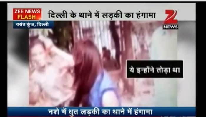 OMG! Why is this drunk woman punching lady cop, creating a ruckus at Delhi&#039;s Vasant Kunj police station? - WATCH
