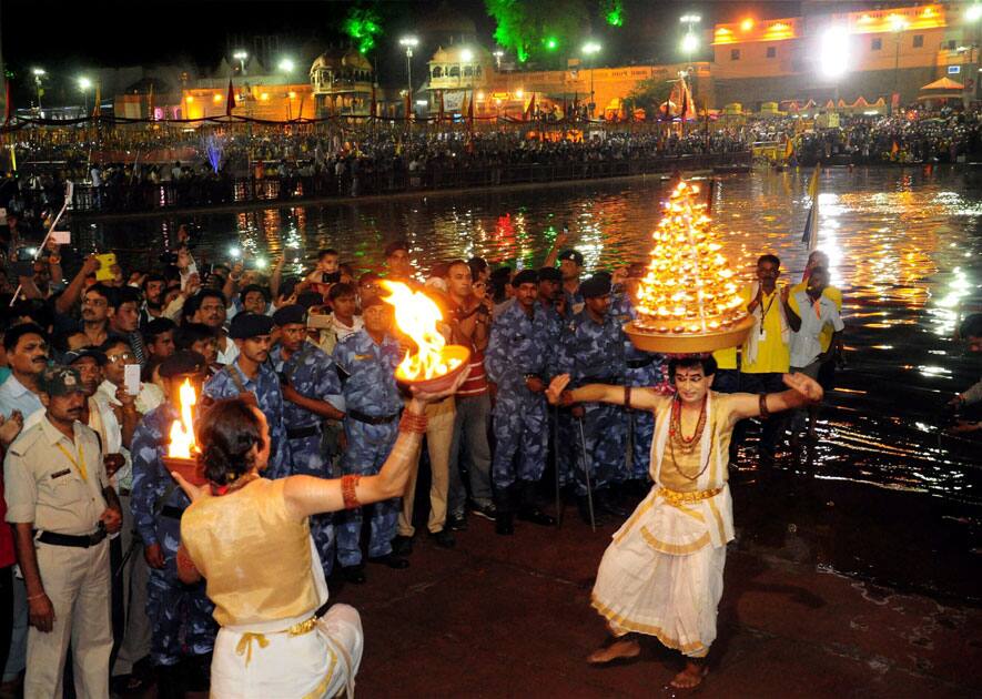 Devotees attend an aarti of holy river Kshipra during Simhastha Maha Kumbh Mela in Ujjain, Madhya Pradesh.