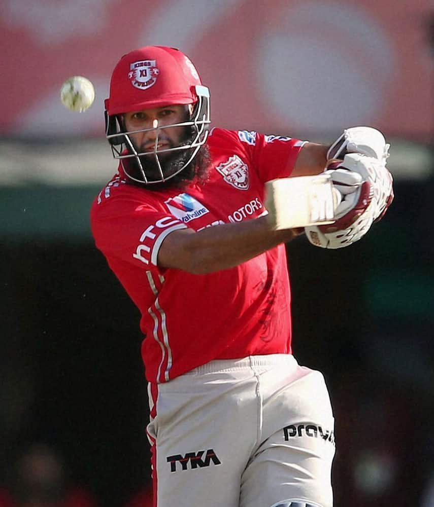 Hashim Amla of Kings XI Punjab hits over the top for a boundary during the IPL match against Sunrisers Hyderabad in Mohali.