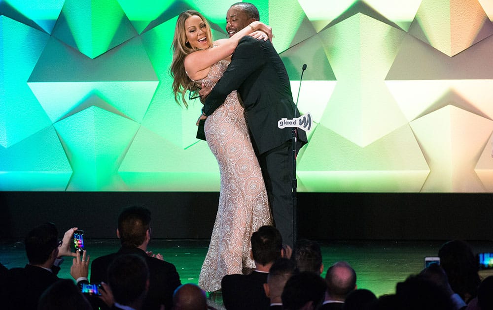 Honoree Mariah Carey accepts her award from Lee Daniels at the 27th Annual GLAAD Media Awards at the Waldorf Astoria in New York.