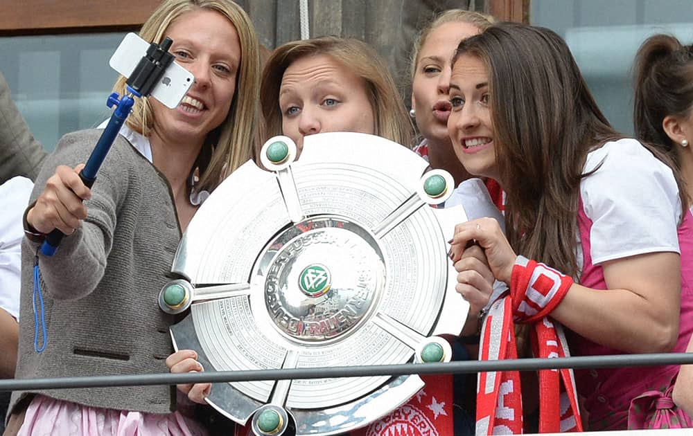 The womens team of Bayern Munich takes a picture during celebrations on the balcony of the city hall in Munich. Men and women teams of Bayern Munich became German soccer Champion. 