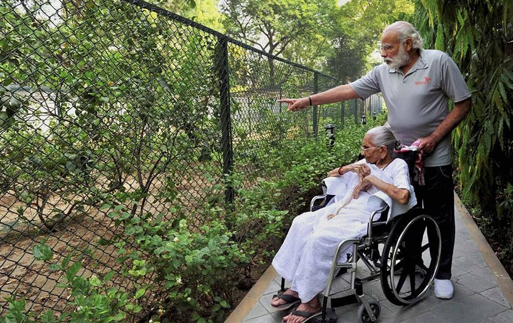 Prime Minister Narendra Modi with his mother Hiraba at the 7RCR in New Delhi during the latters first visit to the PMs residence. 