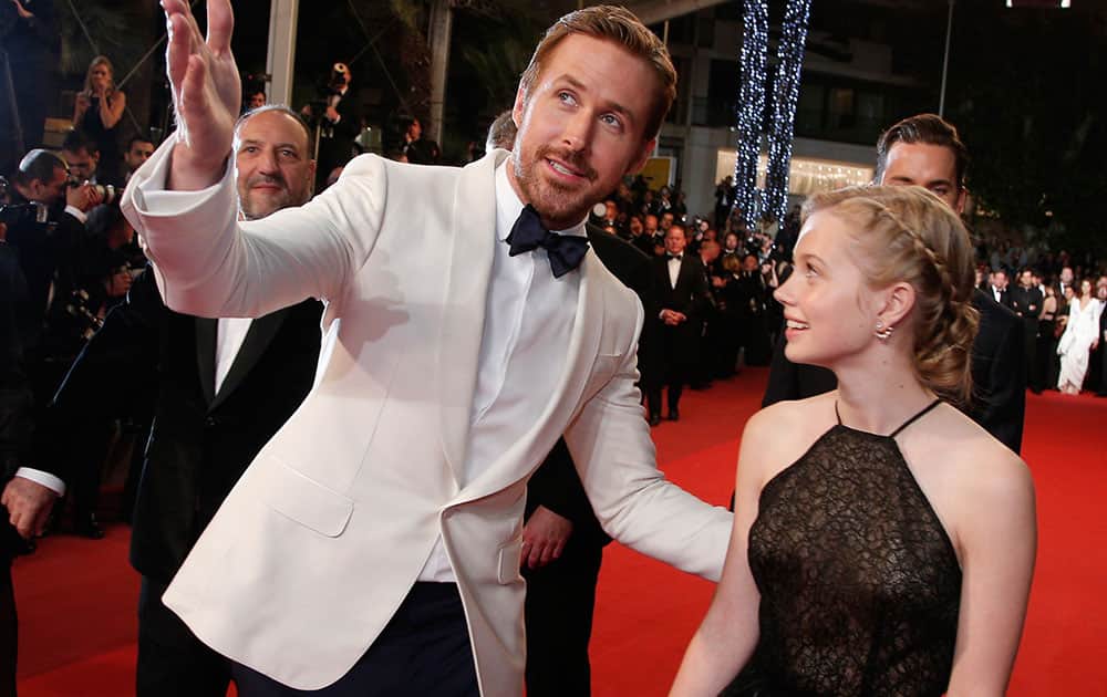 Actors Ryan Gosling, left, and Angourie Rice pose for photographers upon arrival at the screening of the film The Nice Guys at the 69th international film festival, Cannes, southern France.