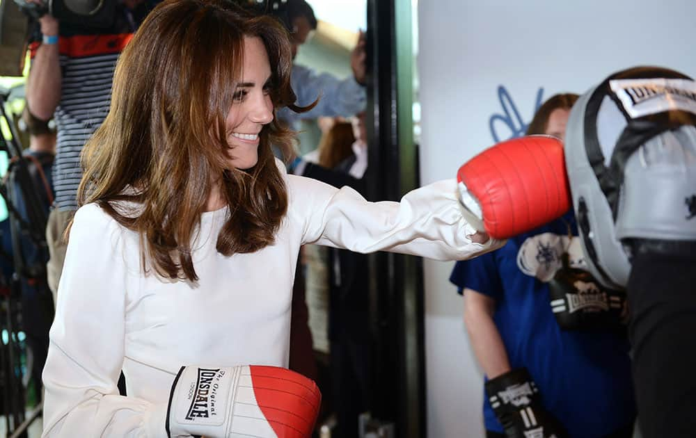 Kate, the Duchess of Cambridge, boxes with former boxer Duke McKenzie during the launch of Heads Together, the ambitious new campaign to end stigma on mental health, at the Olympic Park in London.