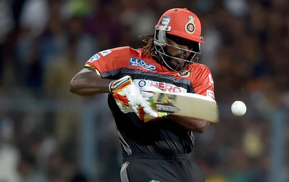 RCB batsman Chris Gayle plays a shot during an IPL match against KKR at Eden Garden in Kolkata.