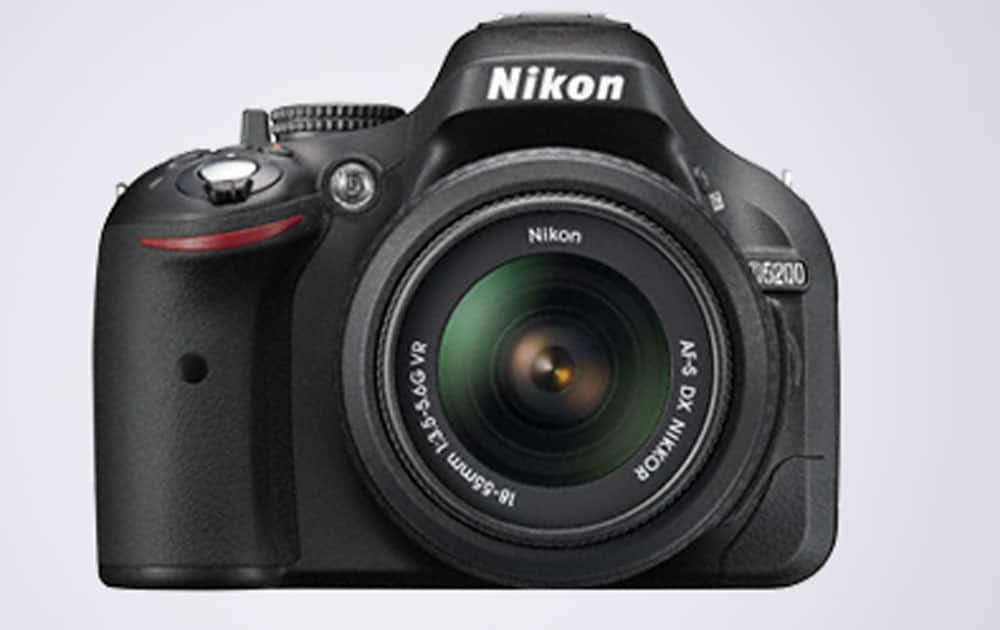 Nikon D5200 priced at Rs 27,990 (Flipkart). It comes with 24.2 MP DX format CMOS (23.5 x 15.6 mm),Articulated 3.0? 921k-dot display,100-6400 ISO ,battery-500 shots.
