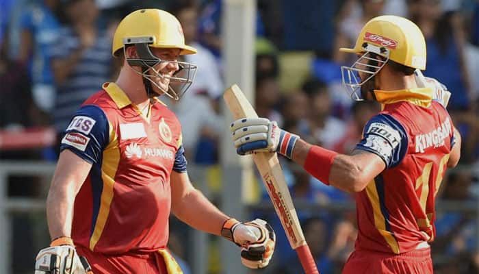 IPL 9: Mighty impressed with their consistency, Chris Gayle compares RCB&#039;s Virat Kohli, AB de Villiers with &#039;Batman and Superman&#039;