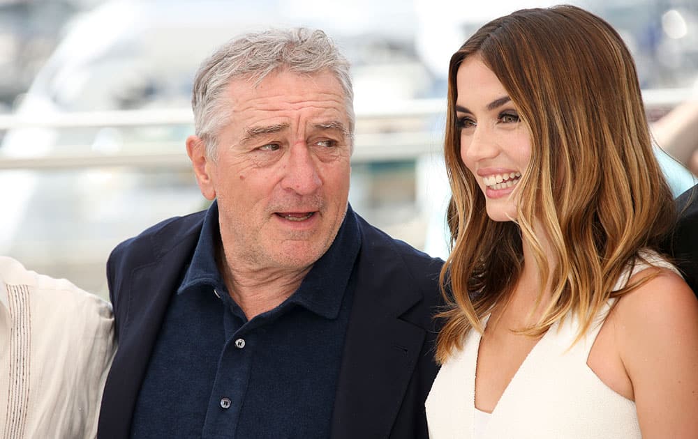 Actor Robert De Niro, left and actress Ana De Armas, pose for photographers during a photo call for Hands of Stone at the 69th international film festival, Cannes, southern France.