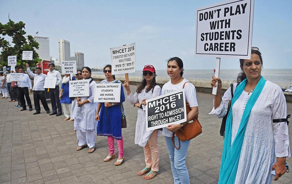 Parents of the students preparing for medical entrance exams, form a human chain to protest against the verdict of Supreme Courts on National Eligibility Entrance Test (NEET) in Mumbai.