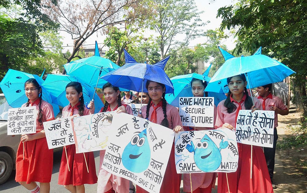 School children take part in a programme with a message Save Water in Moradabad.