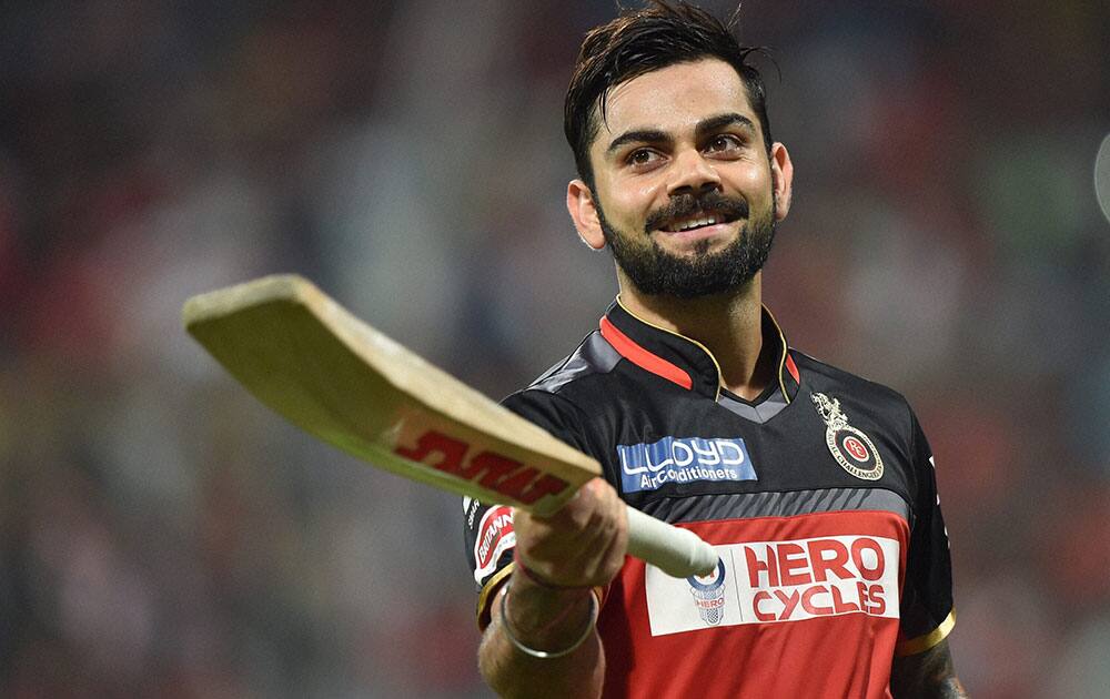 Royal Challengers Bangalores Virat Kohli celebrates his century during an IPL 2016 match against Kings XI Punjab at Chinnaswamy Stadium in Bengaluru.