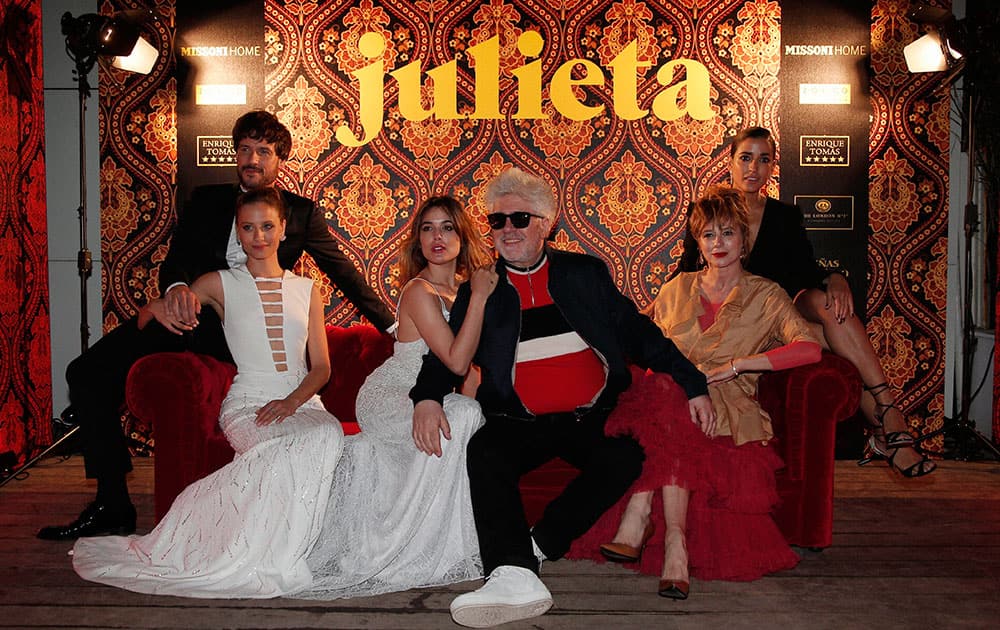 Actors Daniel Grao, from left, Michelle Jenner, Adriana Ugarte, director Pedro Almodovar, Emma Suarez and Inma Cuesta pose for photographers at the party for the film Julieta at the 69th international film festival, Cannes.