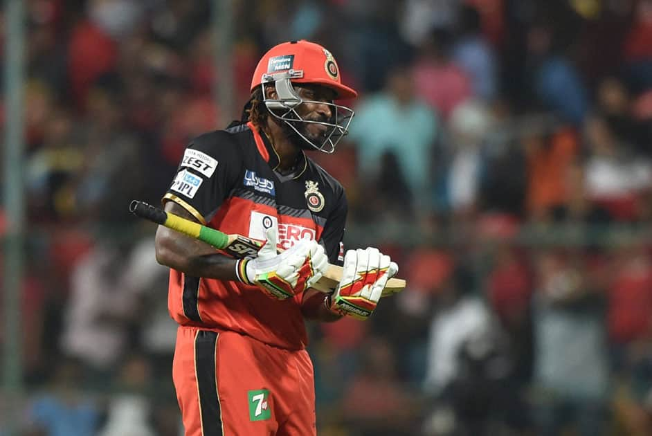 Royal Challengers Bangalores Chris Gayle celebrates his fifty runs during an IPL match against Kings XI Punjab at Chinnaswamy Stadium in Bengaluru.
