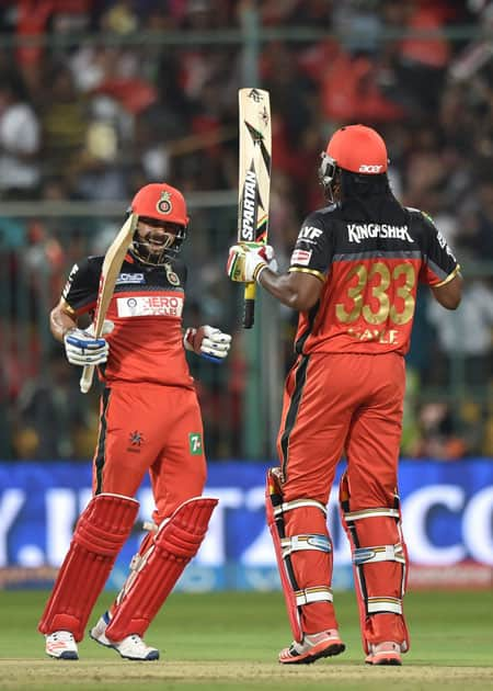 Royal Challengers Bangalores Virat Kohli and Chris Gayle during an IPL match against Kings XI Punjab at Chinnaswamy Stadium in Bengaluru.