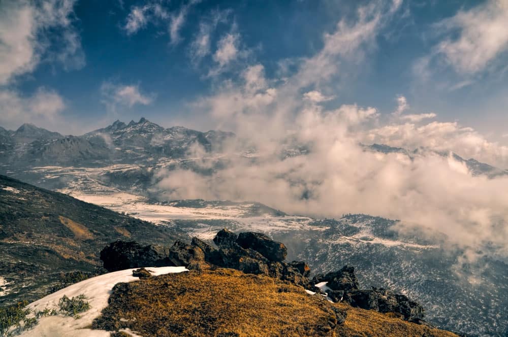 The panoramic view of the mighty Himalayan mountains through the clouds.