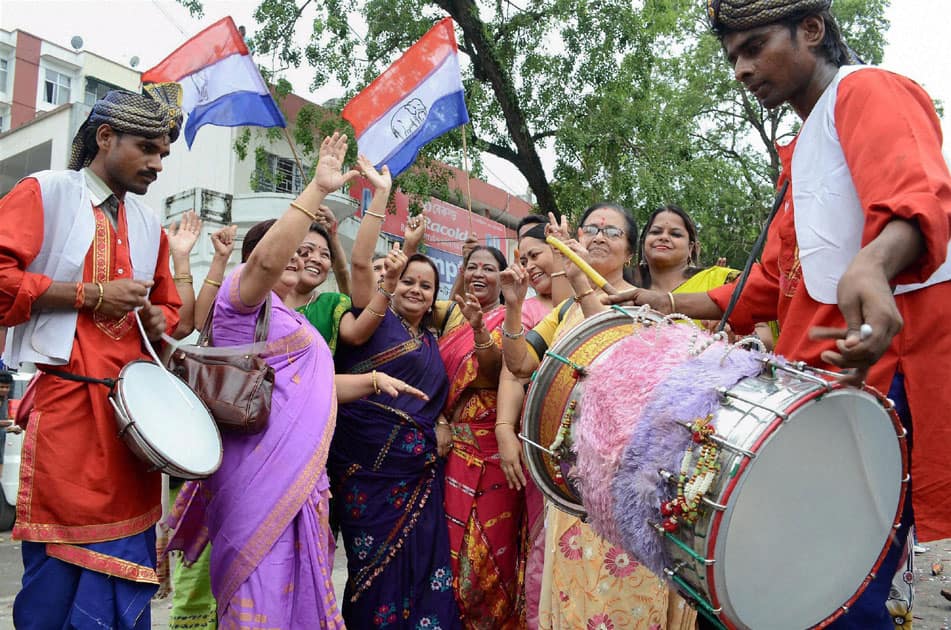 AGP workers celebrate their partys win in Assam Assembly election 2016, in Guwahati.