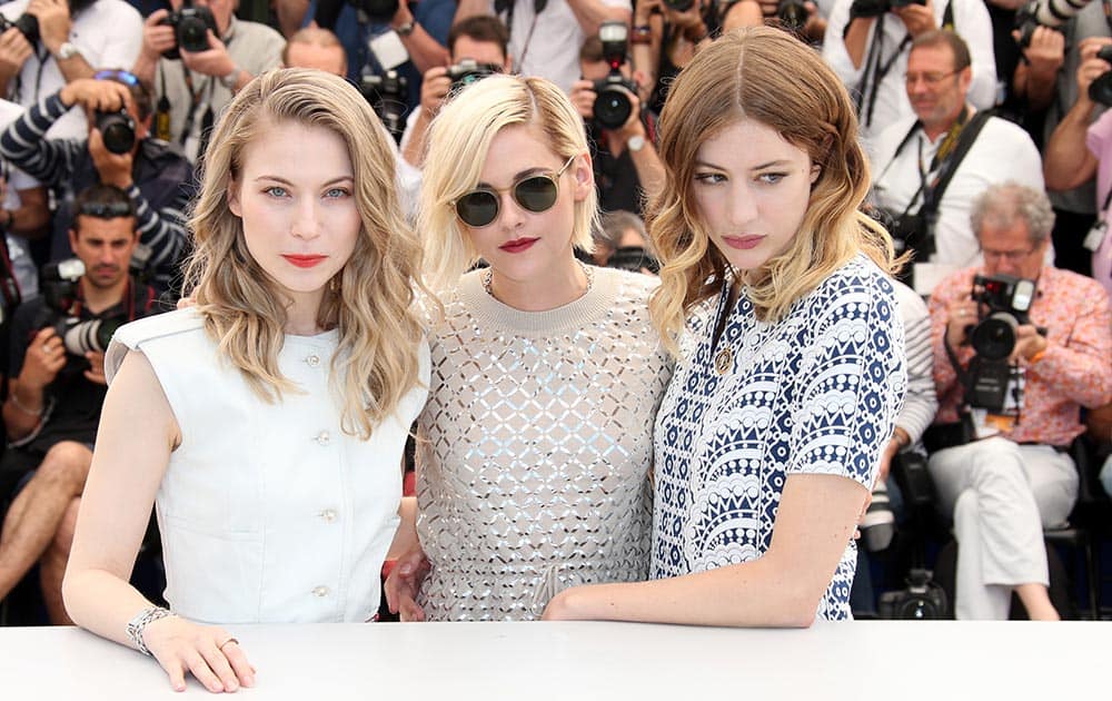 Actresses Nora Von Waldstatten, Sigrid Bouaziz and Kristen Stewart, from left, pose for photographers during a photo call for the film Personal Shopper at the 69th international film festival, Cannes.