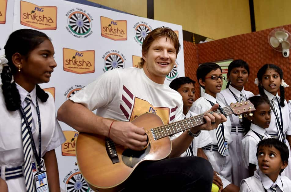 Australian Cricketer Shane Watson plays guitar during an event of Shiksha Padega India Badhega India in Bengaluru.