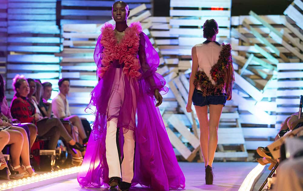 Zaria McDonald, 17, of St. Louis, walks the runway during the Lindenwood University Fashion Design program fashion show at Mercedes-Benz St. Louis.