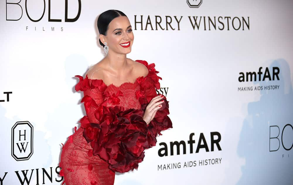 Singer Katy Perry poses for photographers upon arrival at the amfAR Cinema Against AIDS benefit at the Hotel du Cap-Eden-Roc, during the 69th Cannes international film festival, Cap d'Antibes, southern France.