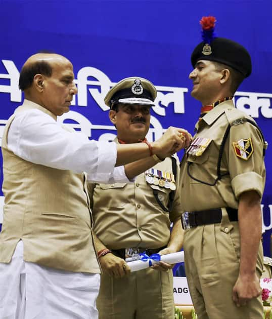 Union Home Minister Rajnath Singh presenting Police medal to a personnel during the 14th BSF Investiture ceremony, in New Delhi.
